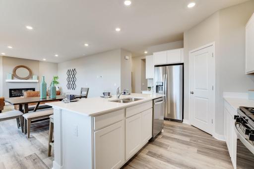 Stunning in every direction, the kitchen is also remarkably functional - leaving plenty of space for the family chef to maneuver and prepare that next meal. Photo of model, colors & options will vary.