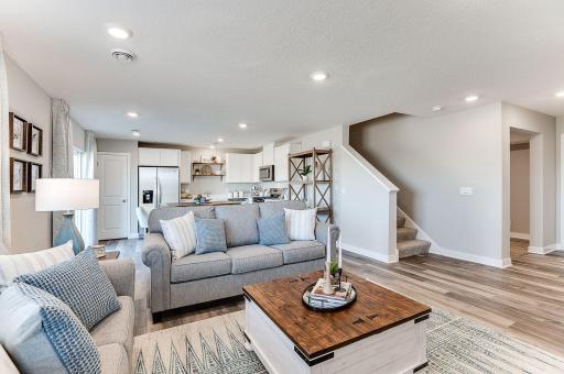 At the end of day, the living room provides a great space to kick up your feet and relax. Photo of model home, color & options will vary.