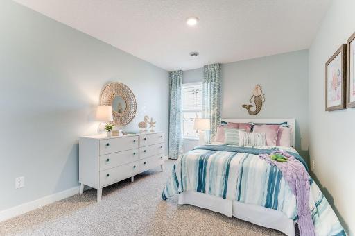 All four bedrooms upstairs are spacious and bright! Photo of model home, color & options will vary.