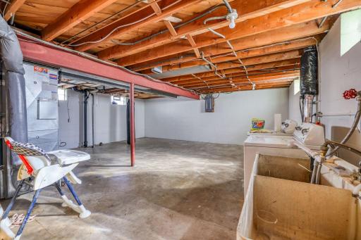 Huge unfinished space in basement perfect for storage or finishing to add equity