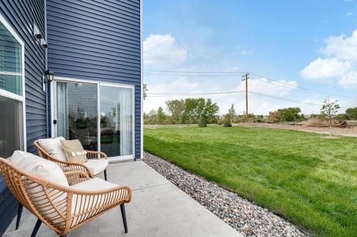 Enjoy Summer evenings on your private rear patio! Photo of model home, color & options will vary.