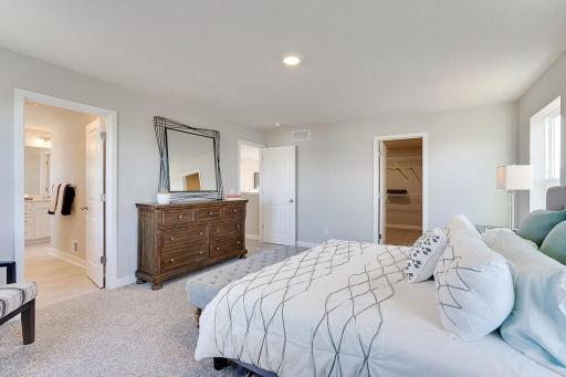An oasis on its own, the home's primary suite is awesome and loaded - including immediate access to a MASSIVE walk-in closet as well as a private bath that is equally stocked with features. *PHOTO OF PREVIOUS MODEL. SELECTIONS MAY VARY.