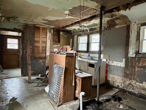 Main floor kitchen and previous bathroom