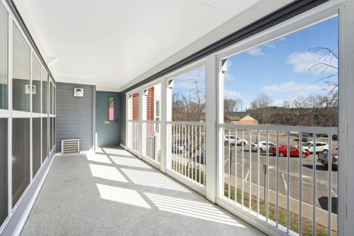 Spacious communal porch with lounge furniture present in warmer months
