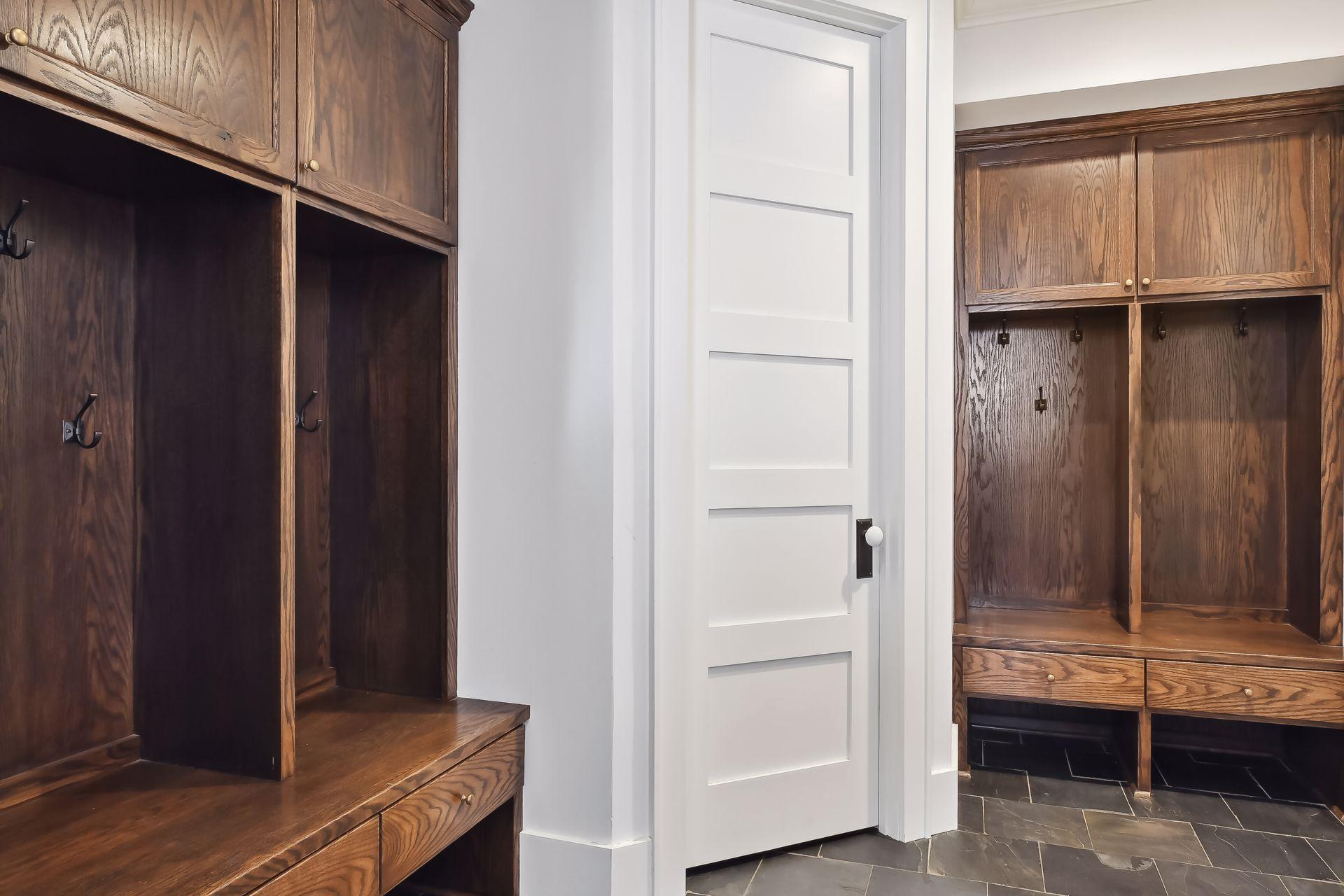 Dreamy Mudroom featuring custom lockers and loads of storage!