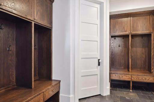 Dreamy Mudroom featuring custom lockers and loads of storage!