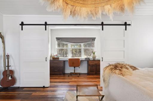 The primary suite hosts a home office space