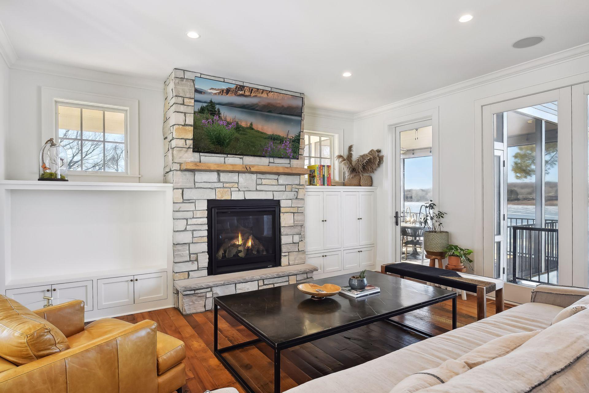 Main Level Living Room with Stone Gas Fireplace