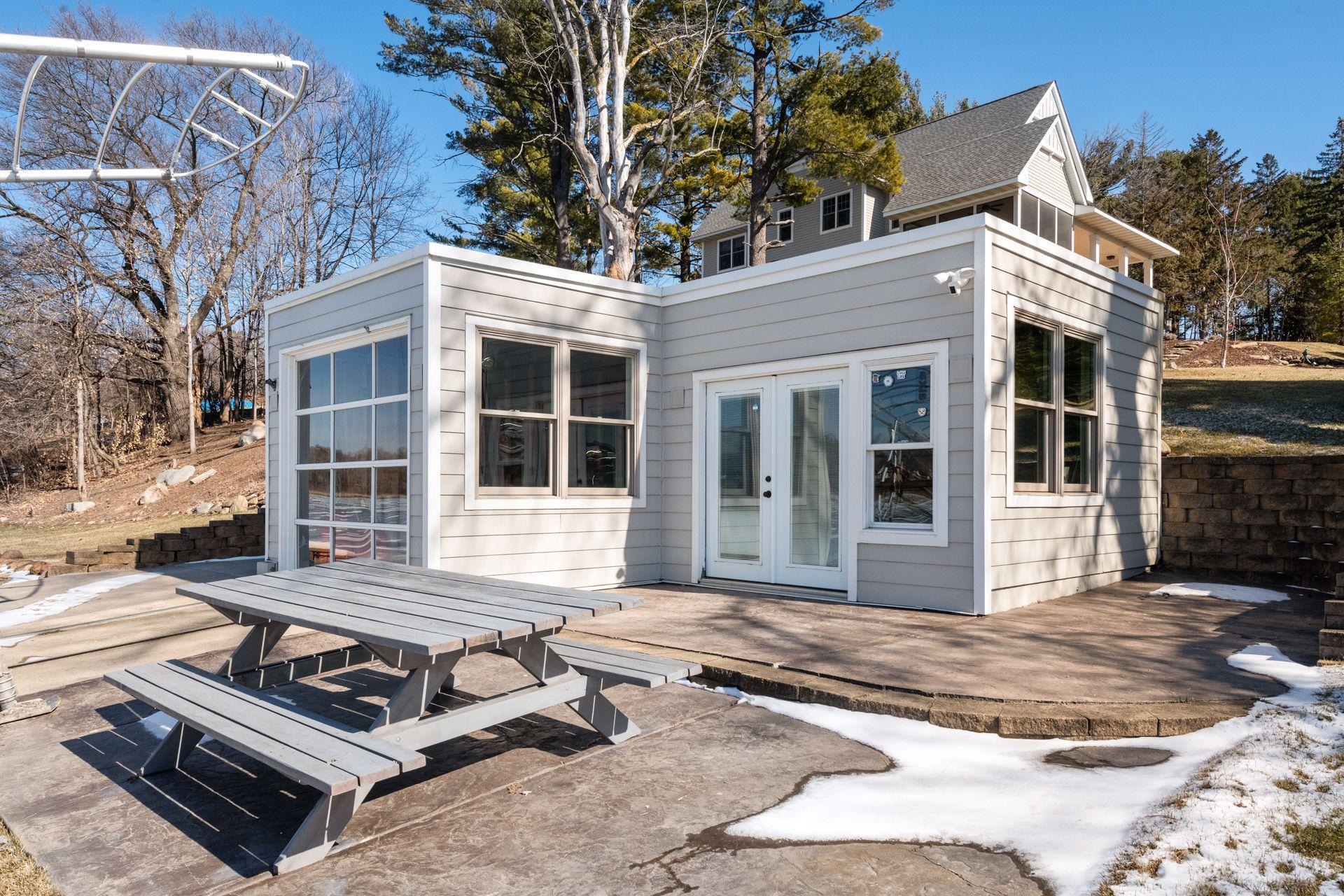 The charming boat house has electrivity, patio space and serves as an ideal lakeside retreat.