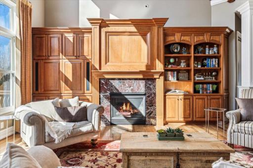 Great room is warmed by the beautiful tile surround gas fireplace.