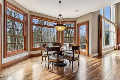 Bright and sunny dinette area, with large bay windows overlooking the backyard.