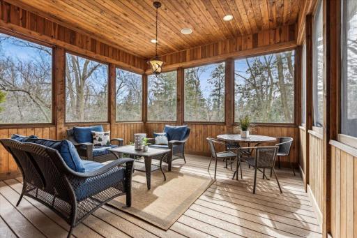 Enjoy the great outdoors from the comfort of the beautiful screened porch.