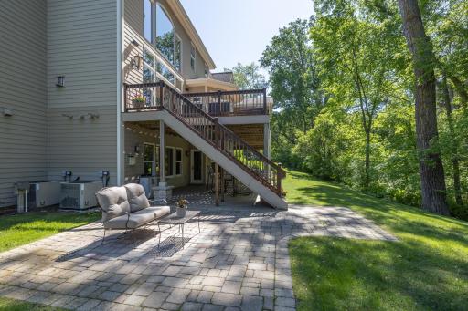 Large stamped concrete patio is another great space to enjoy the backyard views and creek sounds.