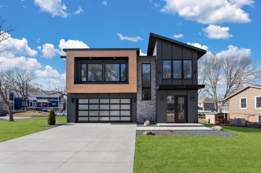 Contemporary design with a 4 car heated and cooled garage