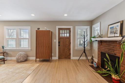 Front door entry - so warm & welcoming with the bright light and cozy fireplace inviting you in.