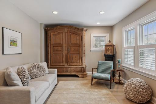 Tons of natural light pouring in this lovely living room space