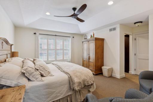 Beautiful and serene primary bedroom - high ceilings and lots of natural light