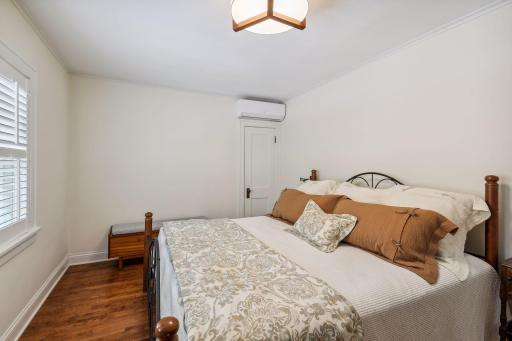 Second bedroom space - sooo cozy! Gleaming hardwood flooring too.
