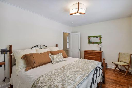 Second bedroom space - sooo cozy! Gleaming hardwood flooring too.