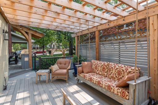 Such a beautiful, cozy additional outdoor space! Perfect place for your morning coffee or a glass of wine! Updated porch & decking!