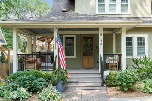 Soooo warm & inviting having a front porch. Remarkable front porch to watch the world go by! Sooooo warm & inviting!