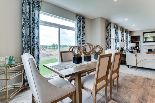 One of two dining spaces on the main level, this informal space rests just off the kitchen and in front of where your future deck will reside! *Photo of model home - colors and options may vary*