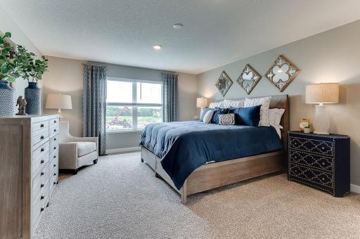 An oasis of its own, the primary suite offers the perfect escape. Windows will overlook the backyard, and there's immediate access to a private bathroom that features TWO walk-in closets!!
*Photo of model home - colors and options may vary*