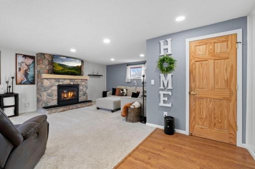 Cozy up in this living room with a updated gas fireplace and new carpet.