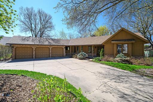 Welcome to 161 E 107th Street Circle! This custom built rambler home sits on the bluffs overlooking the beautiful Minnesota River Valley. This home has many unique features including the horseshoe shaped concrete driveway.
