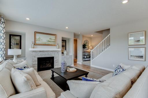 Another view of the large family room with cozy gas fireplace.