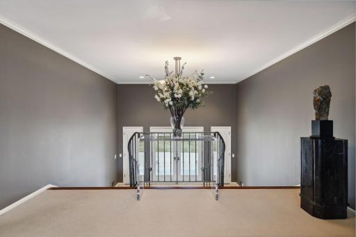 Upper level landing looking toward front door