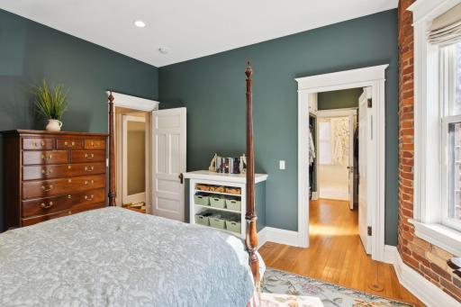 Spacious walk-in closet takes you back to the ensuite bath.