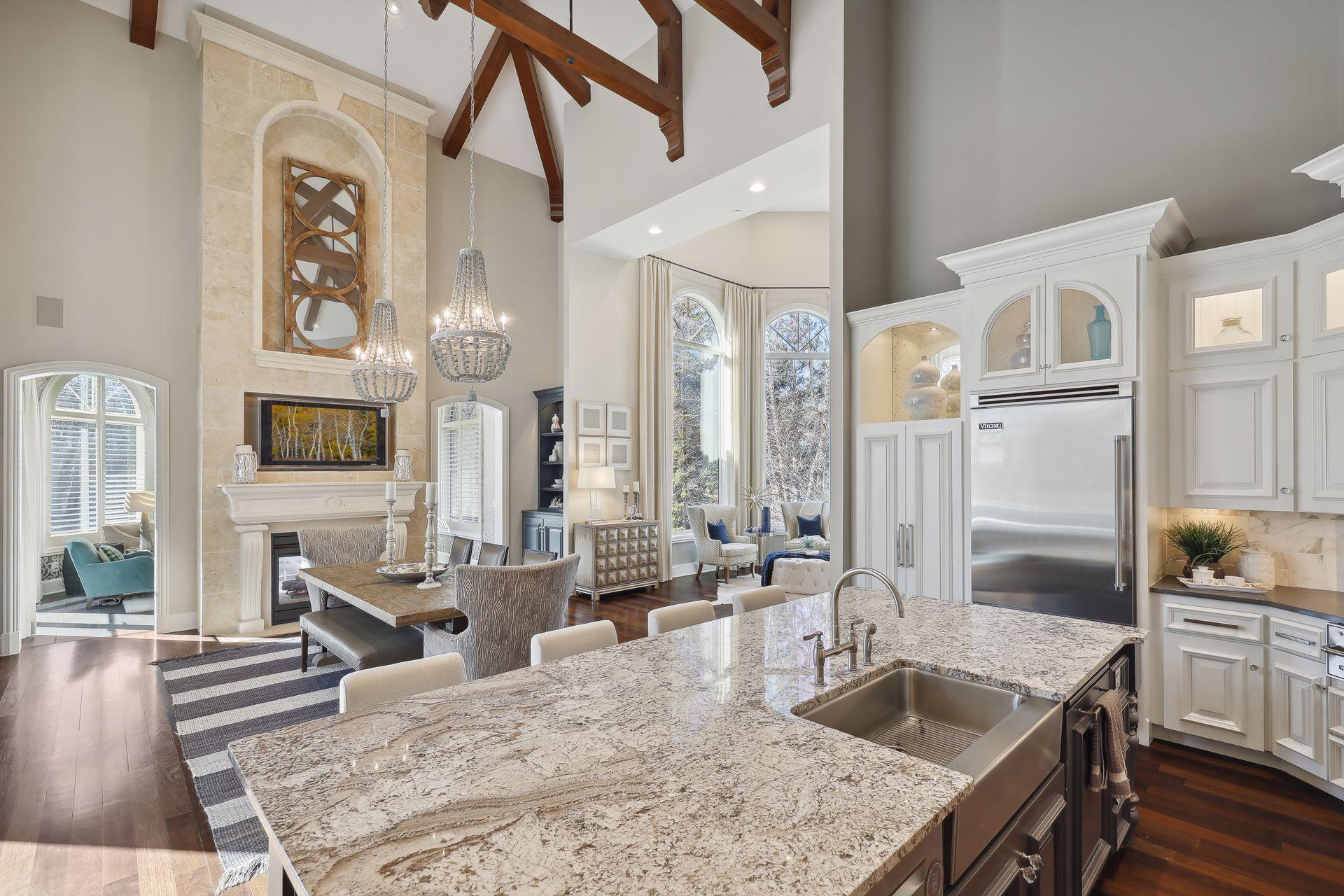 Open concept with vaulted and beamed ceiling