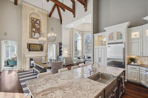 Open concept with vaulted and beamed ceiling