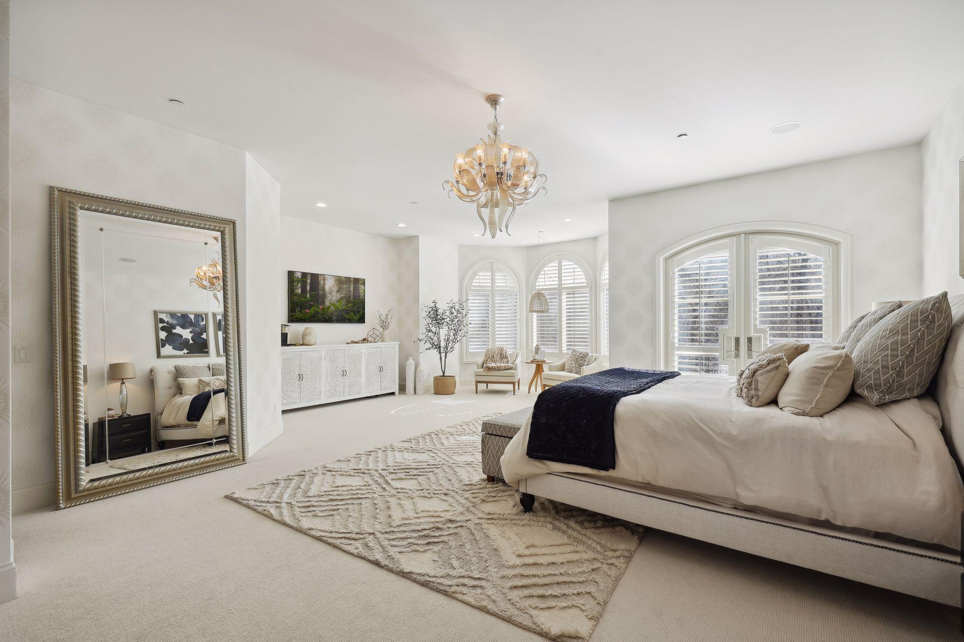 Large room with frech doors leading to balcony