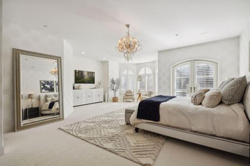 Large room with frech doors leading to balcony