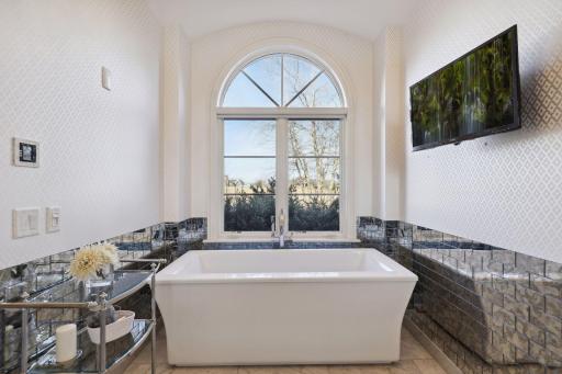 Soak in the tub while watching your favorite show