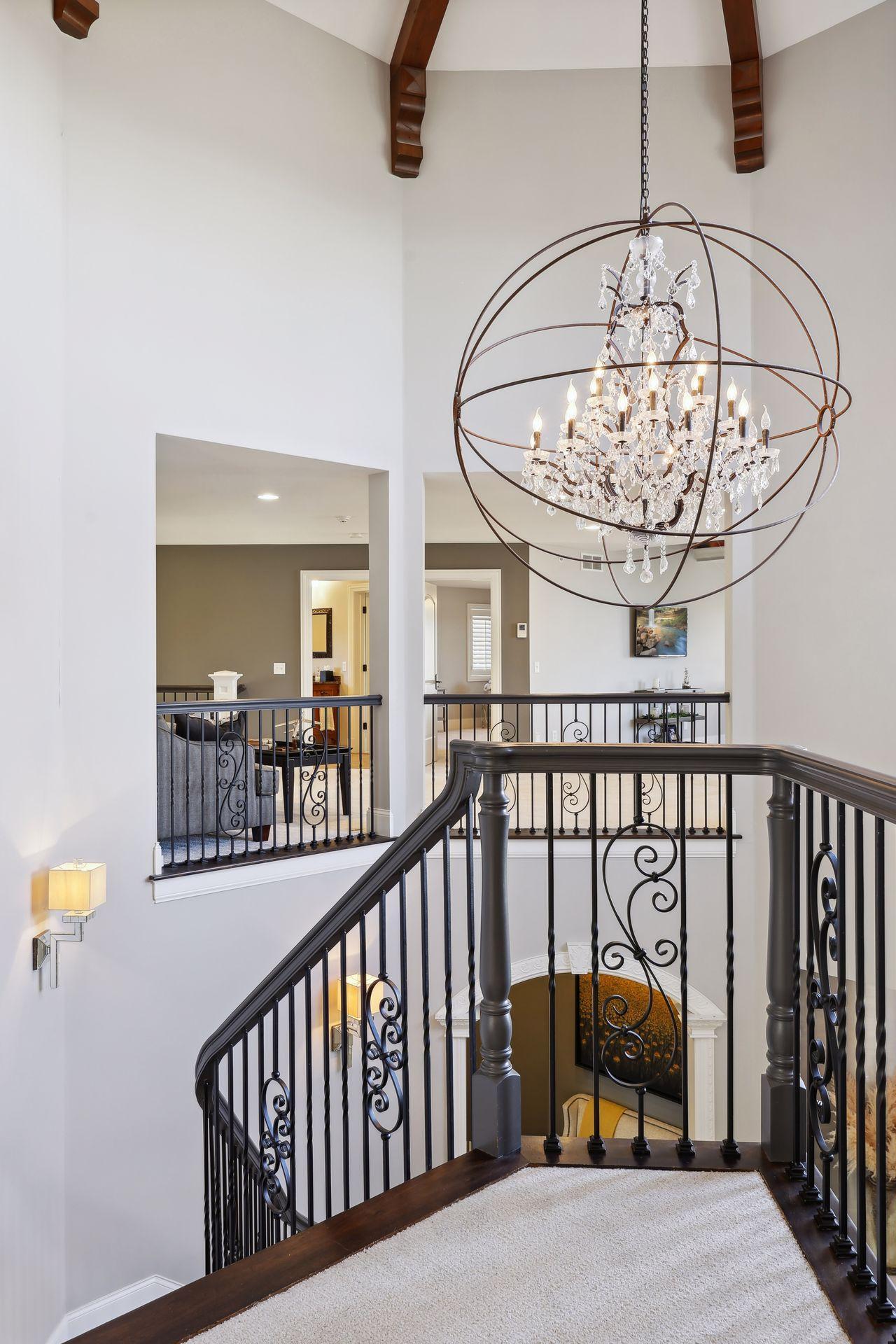 Entry way chandelier. View from guest wing looking over to main upper level bedrooms