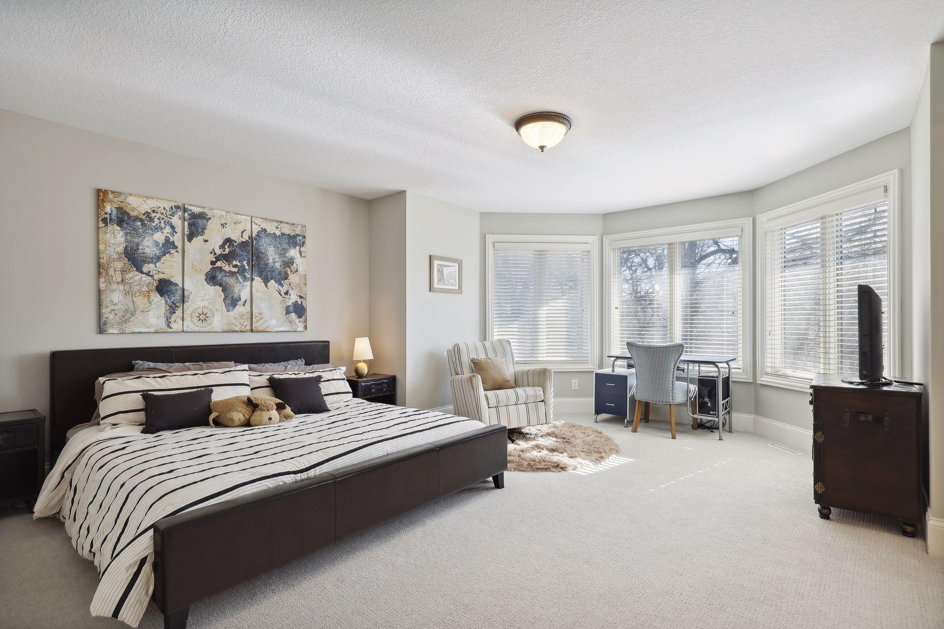 Upper level ensuite bedroom #2 with private full bathroom