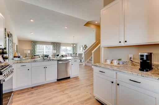 An abundance of cabinet space makes this a desirable kitchen layout. *Pictures are of model home; actual finishes may vary.