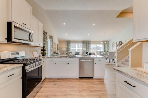 Clean sight lines from the kitchen to throughout the rest of the main level keeps things light and bright. It also means you're never too far from the conversation. *Pictures are of model home; actual finishes may vary.
