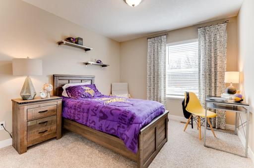 Two secondary bedrooms are also located on the upper level. *Pictures are of model home; actual finishes may vary.