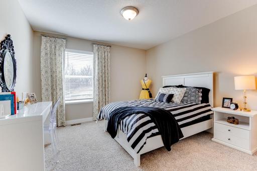 Two secondary bedrooms are also located on the upper level. *Pictures are of model home; actual finishes may vary.