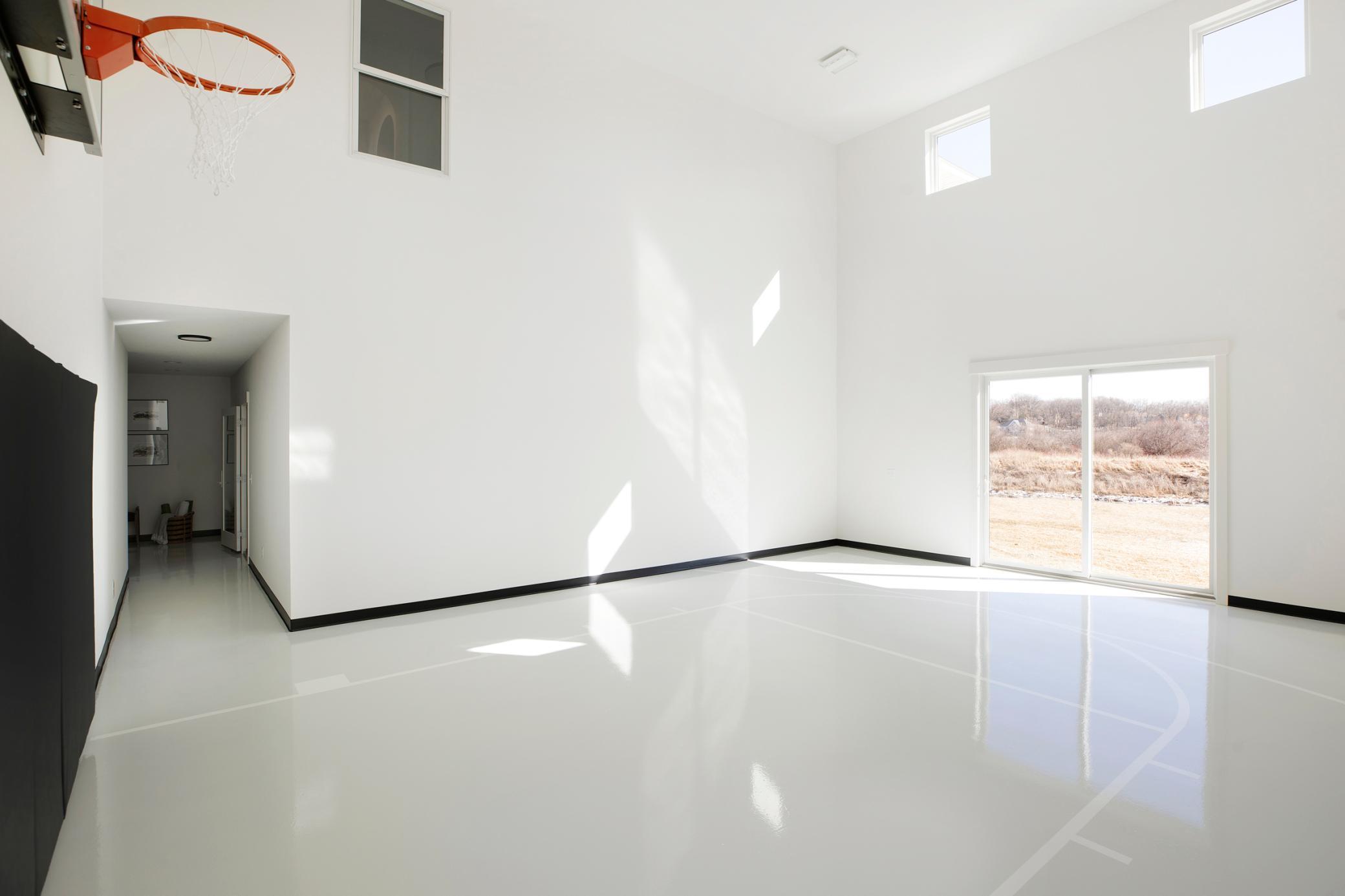 Alt View of Athletic Court with Exercise Room down the Hallway
