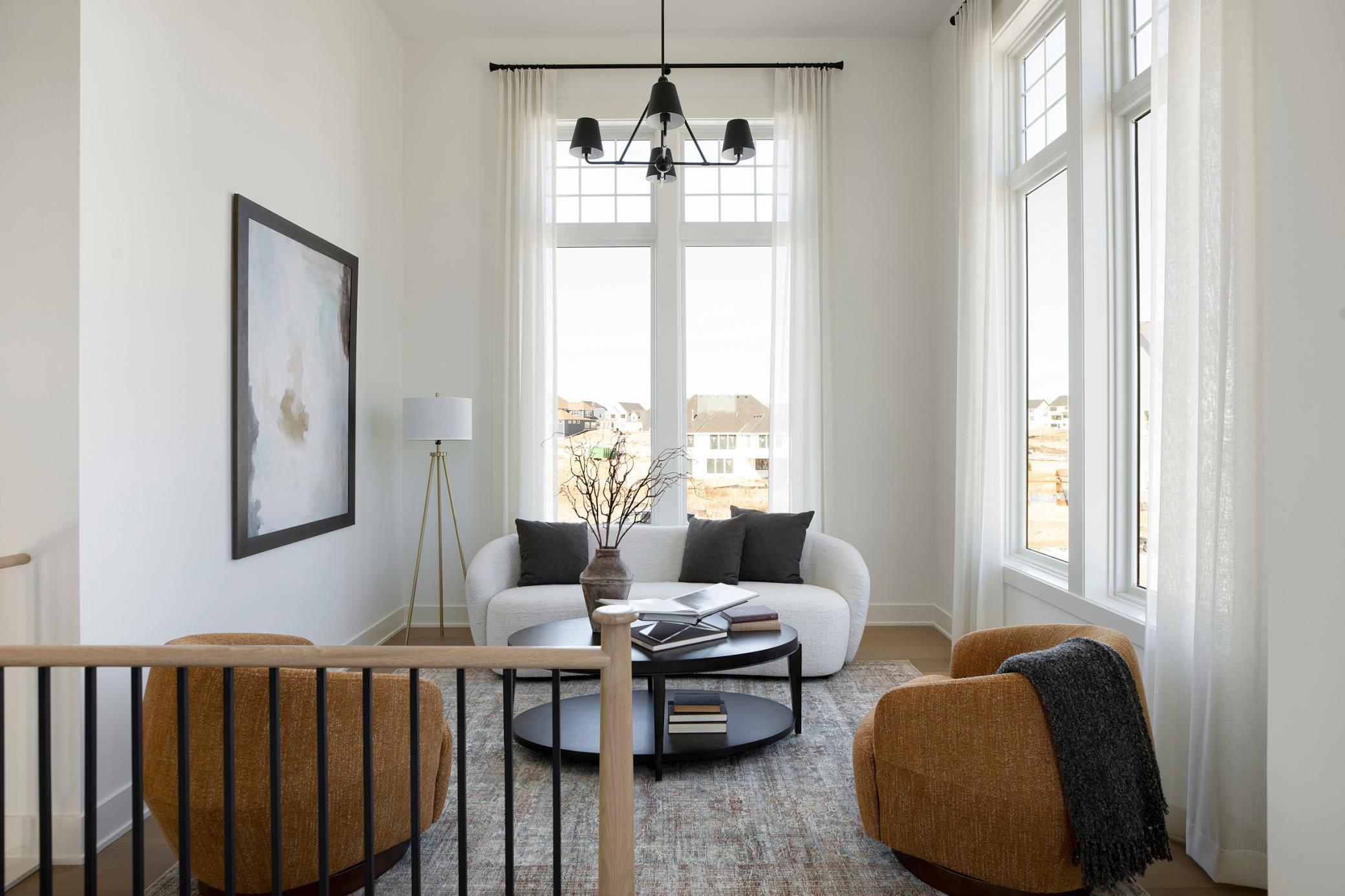 Loft on the landing allows for extra high ceilings and natural light