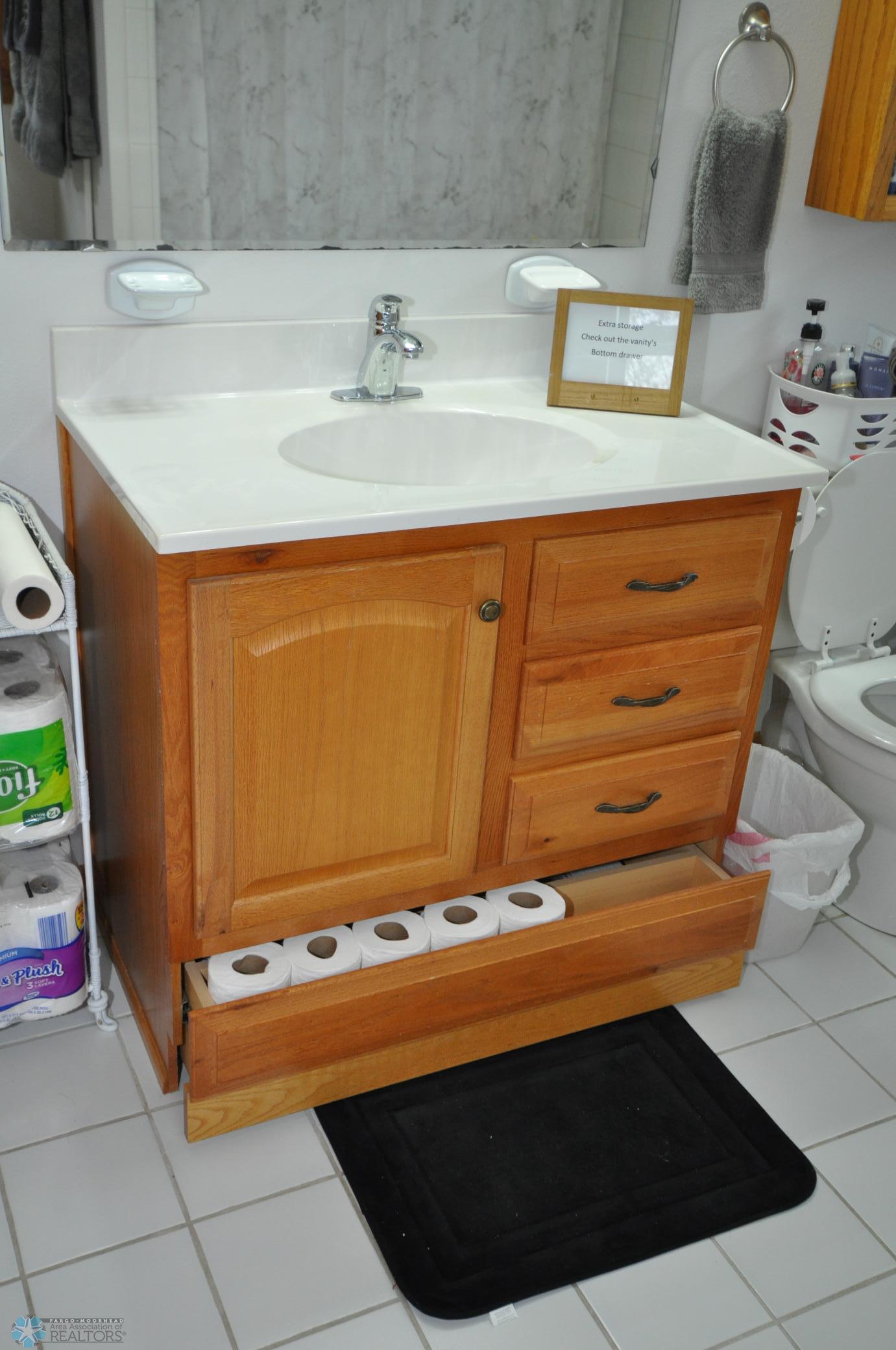 Unique vanity storage in full bathroom
