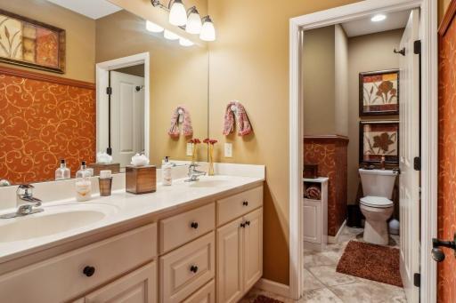 Lower level bathroom with dual vanity.