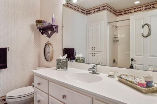 Ensuite full bath with built-in linen closet.