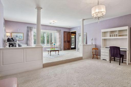 Oversized lower level bedroom with ensuite bathroom and large walk-in closet.