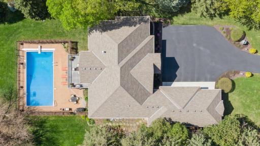 Top areal view of home and pool.